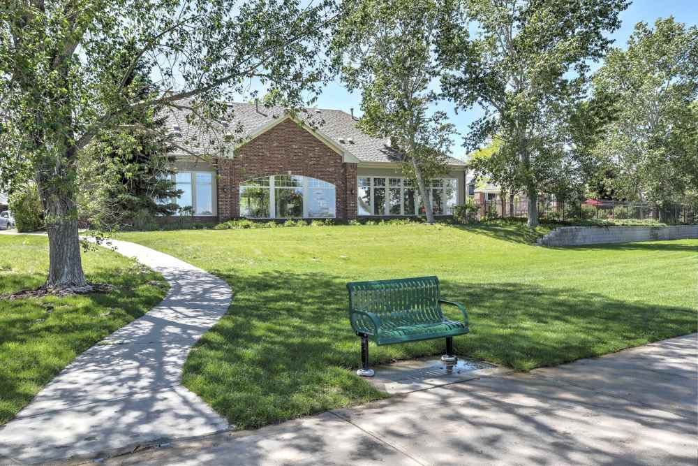 Entrance to the clubhouse with walking trails at Promenade at Hunter's Glen Apartments in Thornton, Colorado