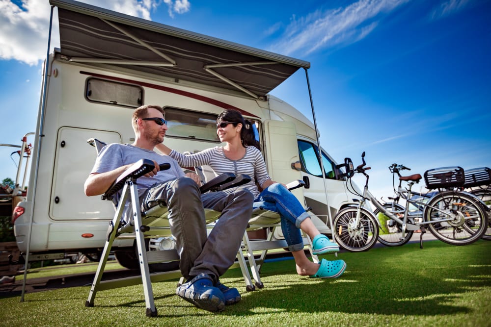 A couple in front of their RV while on a trip away from storage at B Street Self Storage in Forest Grove, Oregon