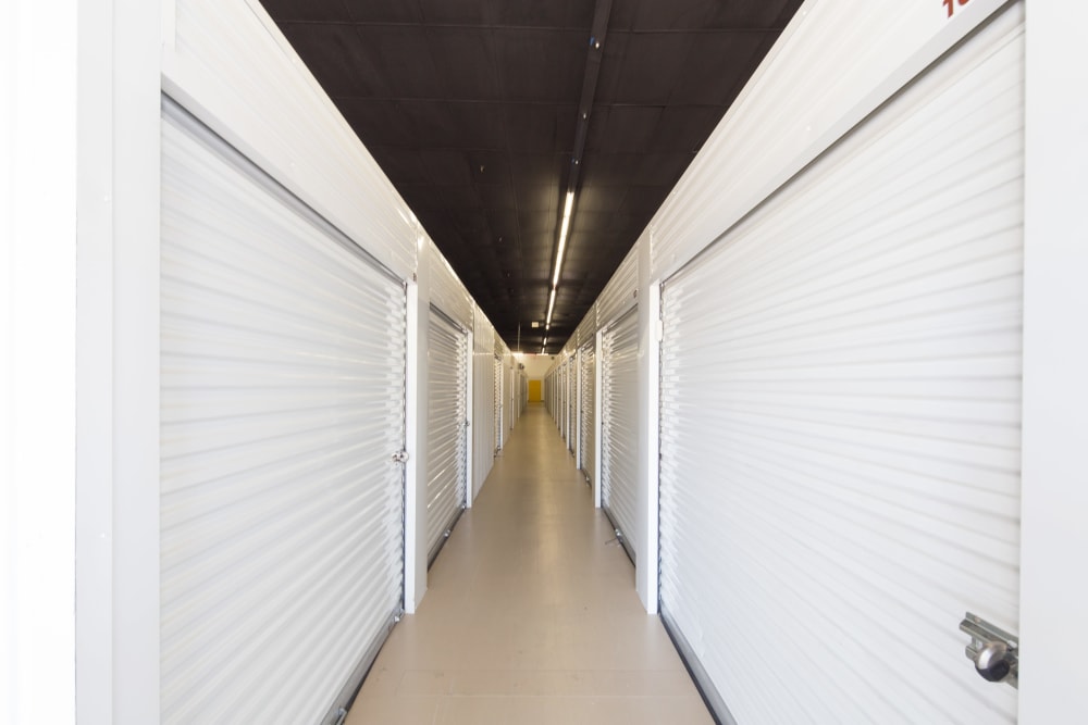 A hallway of indoor storage units at Trojan Storage of Sacramento in Sacramento, California