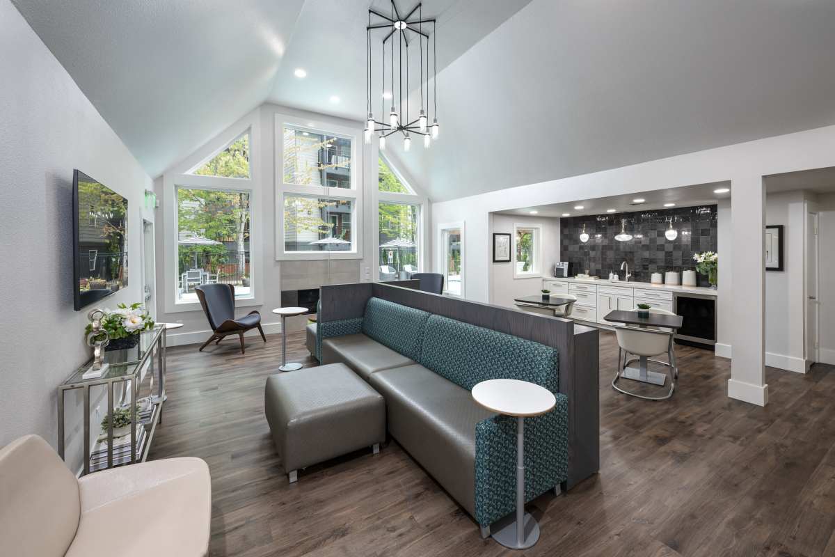 Clubhouse with multiple seating area at Redmond Place Apartments in Redmond, Washington