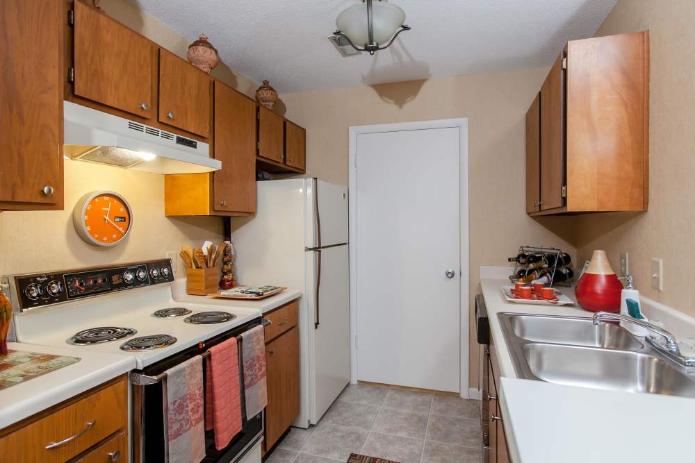 Kitchen with range and stainless-steel sink at Marks Church Commons in Augusta, Georgia