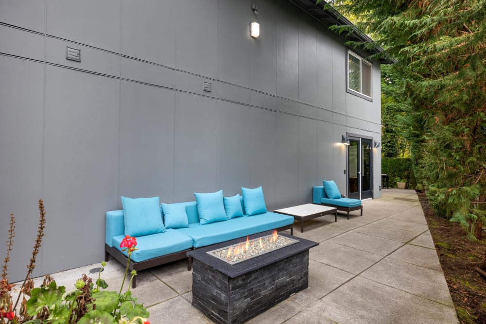 Enjoy the fire pit lounge area at Karbon Apartments in Newcastle, Washington