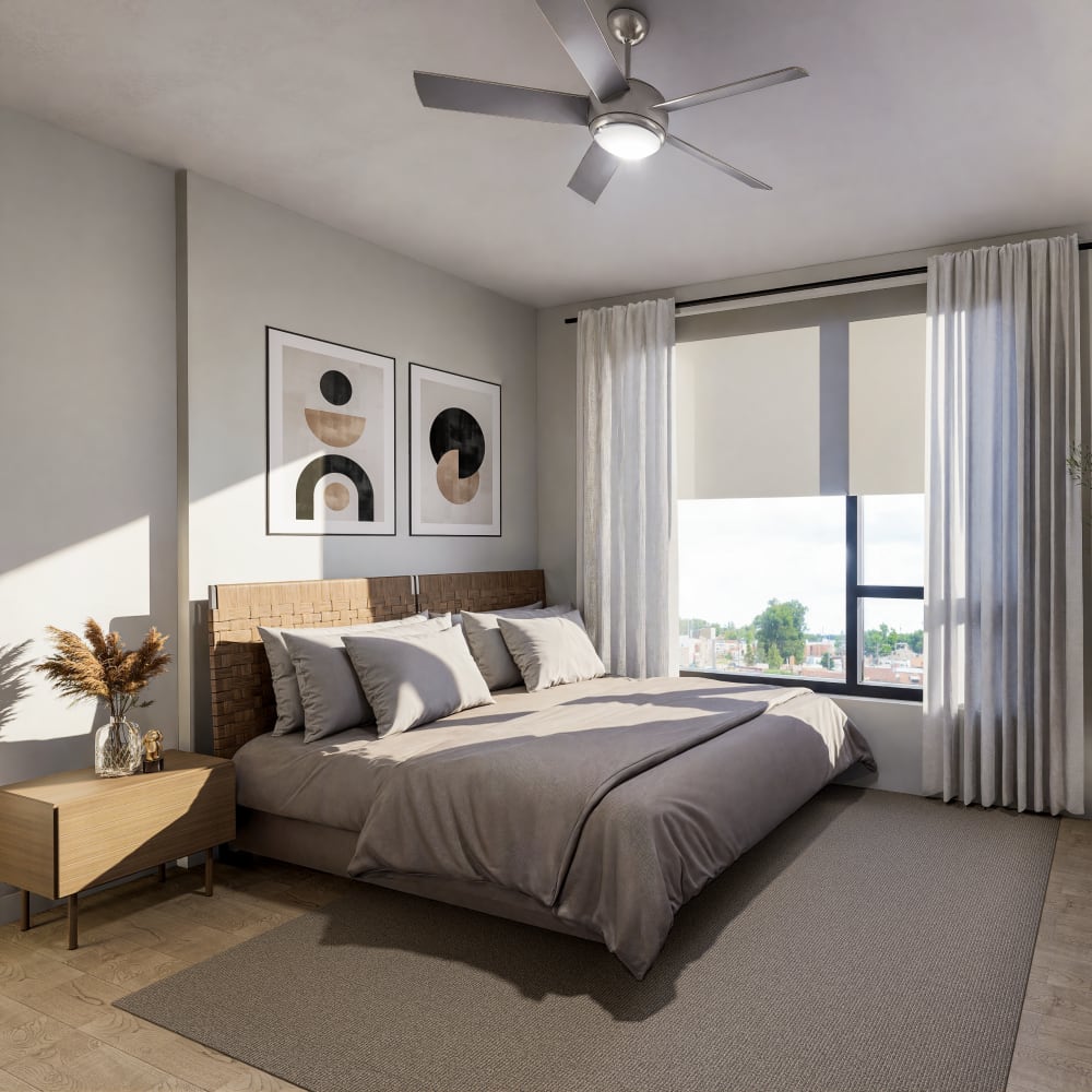 Elegant bedroom with large window and modern decor at Bellwood Gateway Apartments in Bellwood, Illinois