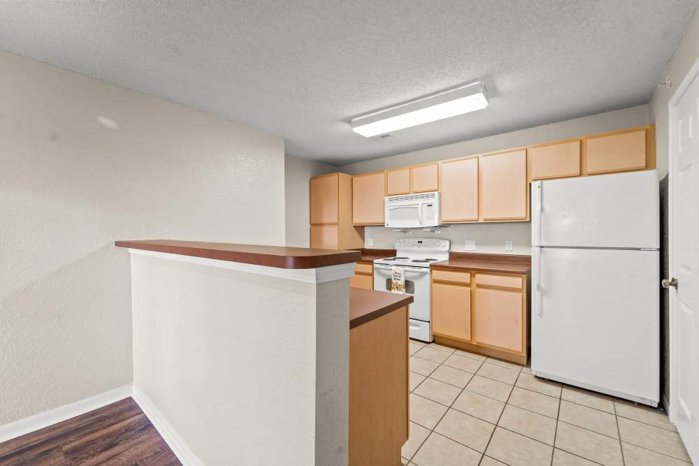 Modern kitchen with stainless-steel appliances at Callaway Village Phase II in Fulton, Missouri
