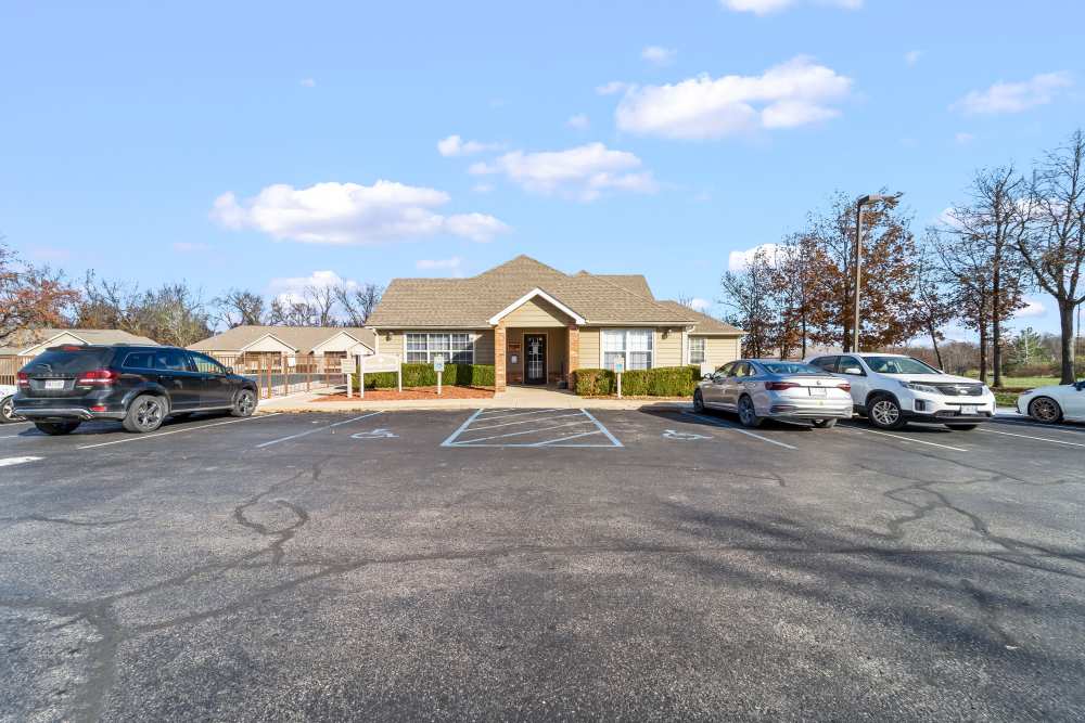 Leasing office with cars parked in drive way at Callaway Village Phase II in Fulton, Missouri