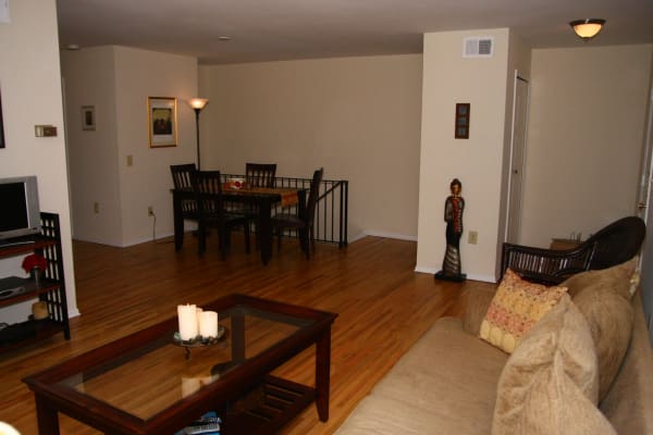 Living room with stunning hardwood floors at Brandywyne East II