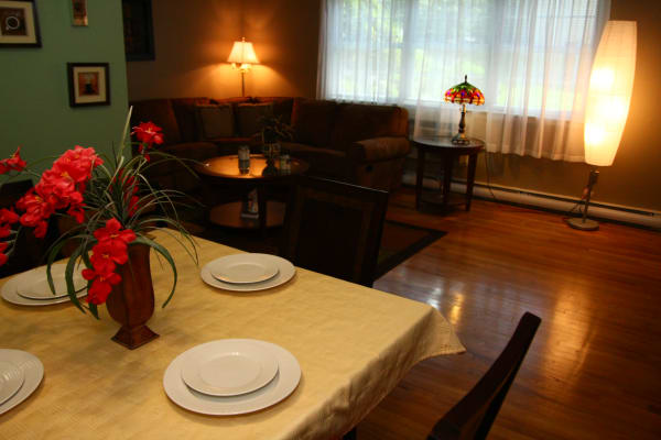 Red flowers in dining room at Cloverdale Associates