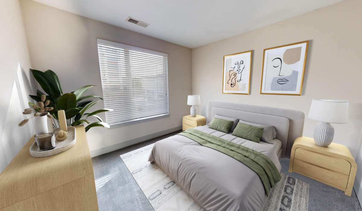 Cozy bedroom with lots of natural light at Gantry Apartments in Cincinnati, Ohio