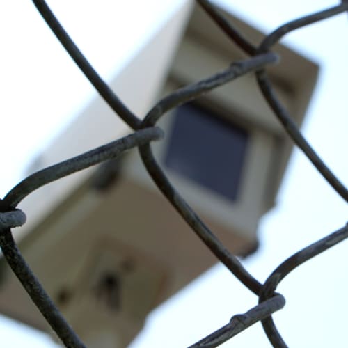 Security camera behind a fence at Red Dot Storage in Lansing, Michigan