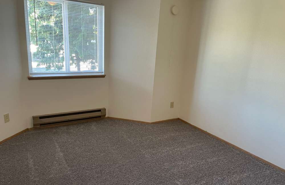 Bedroom with bay window at Cambridge Apartments