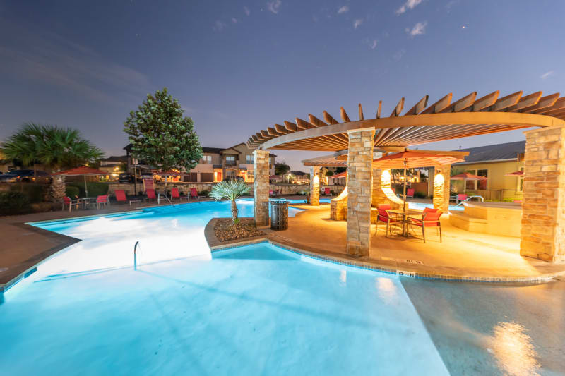 Night time outdoor pool display at Firewheel Apartments in San Antonio