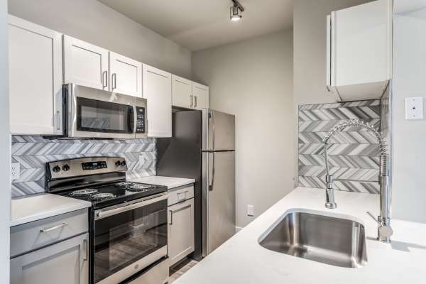 Quartz countertops in the apartment kitchen at Alexander, Spring, Texas