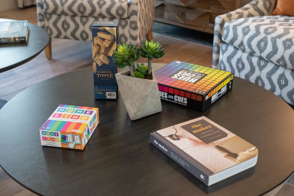 Books and games on a table at Linden at The Rim in San Antonio, Texas