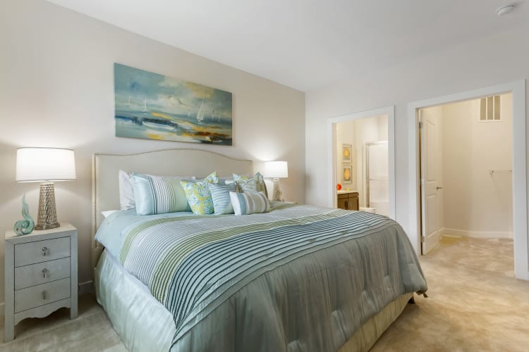 Spacious, furnished main bedroom with an attached bathroom at Sound at Gateway Commons in East Lyme, Connecticut