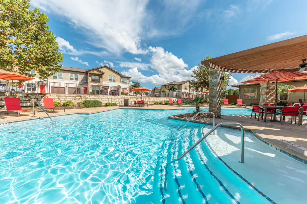 Steps to outdoor pool at Firewheel Apartments in San Antonio
