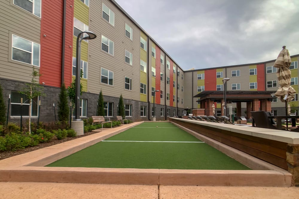 Grass area by pool at Terra at University North Park in Norman, Oklahoma