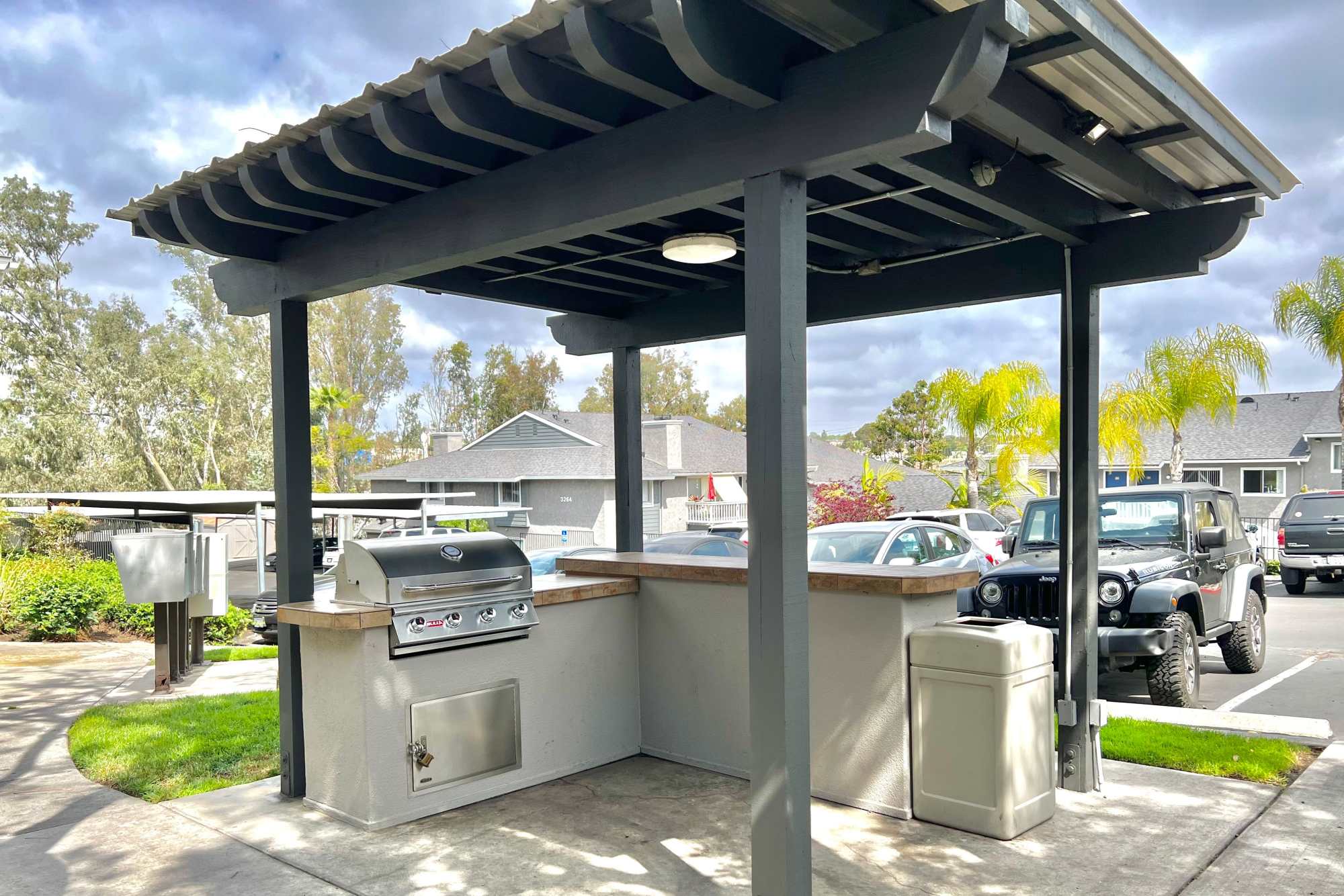 Covered outdoor BBQ area at Hillside Terrace Apartments in Lemon Grove, California
