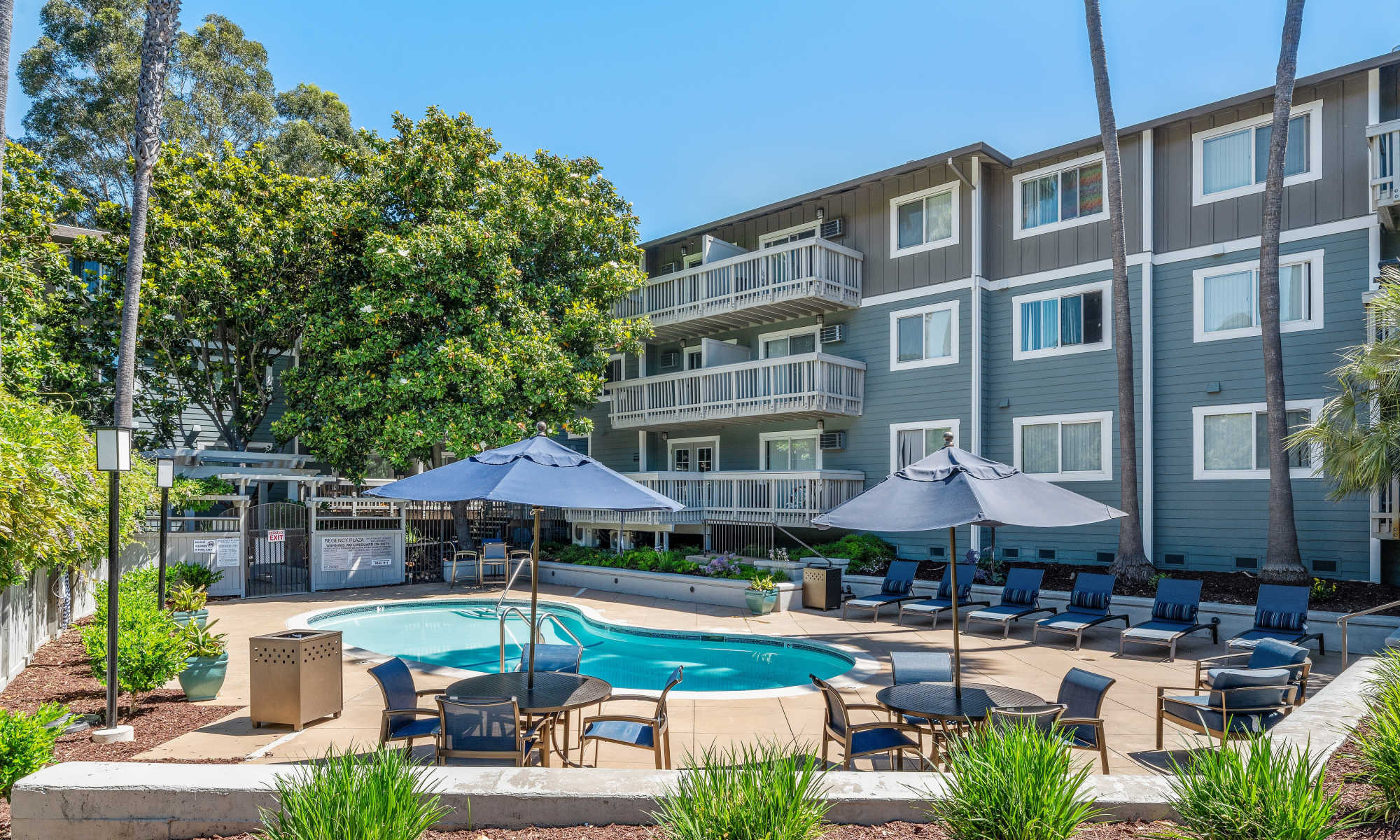 Swimming pool and the building at Regency Plaza Apartment Homes in Martinez, California