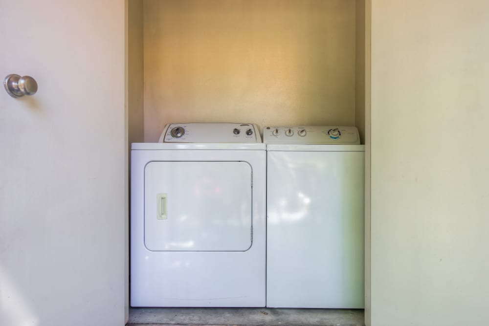 Side-by-side washer and dryer at Tuscany Village Apartments in Ontario, California