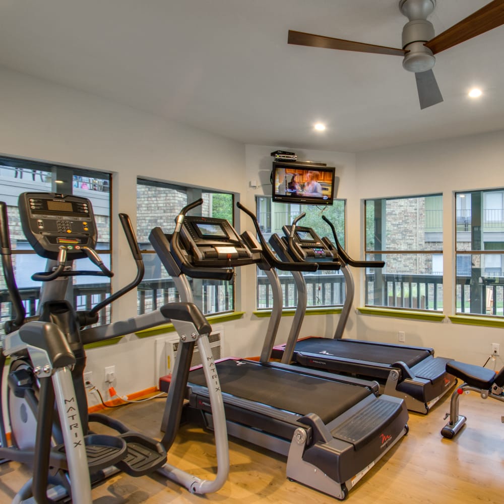 Equipment in the fitness center at Watermarke Apartments in Fort Worth, Texas