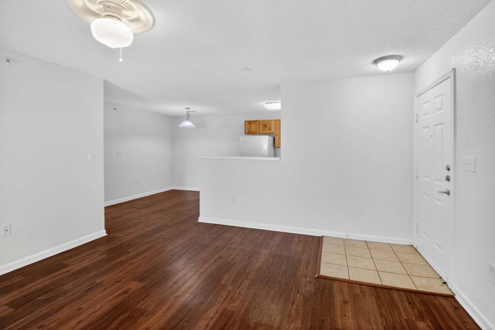 Living room with wood-style flooring at Dunes Apartments in Seminole, Texas