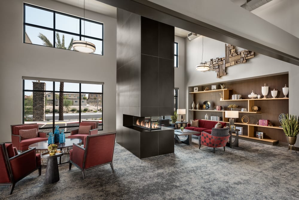 Lounge area around fireplace at Carnegie Heights at Henderson in Henderson, Nevada