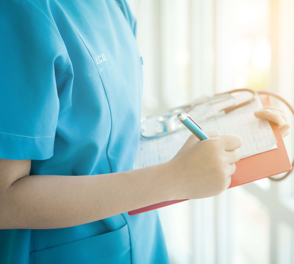 Nurse with clipboard at The Bellettini in Bellevue, Washington