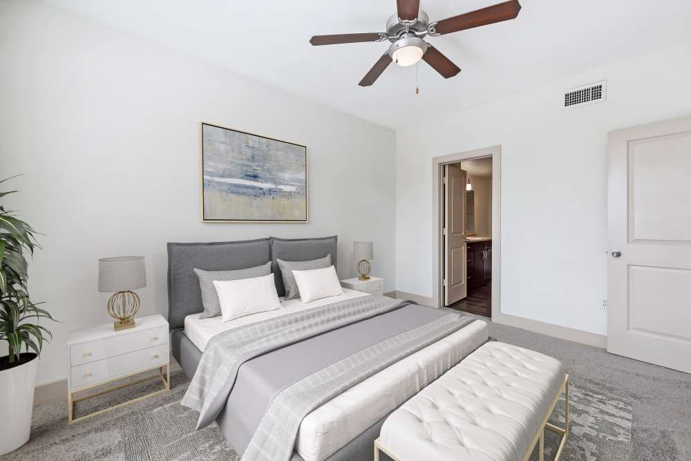 Dining room and living room with wood-style flooring at Villas at Grand Avenue in Pflugerville, Texas