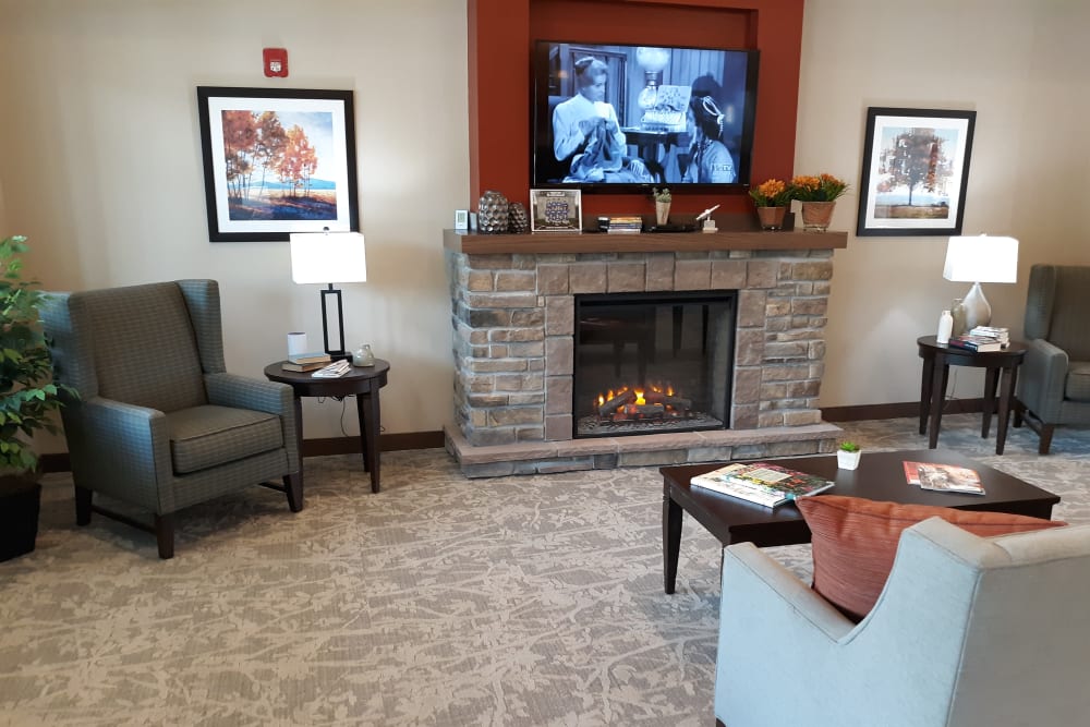 Living room with fireplace at Country Meadow Place in Mason City, Iowa