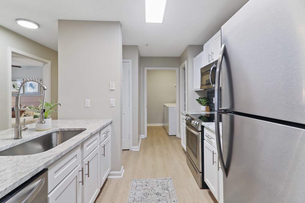 Apartment kitchen with luxury appliances at The Waterford in Morrisville, North Carolina