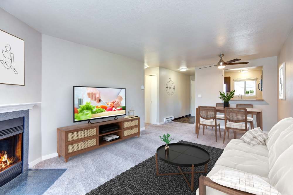Large living room complete with a fireplace at Latitude Apartments in Everett, Washington