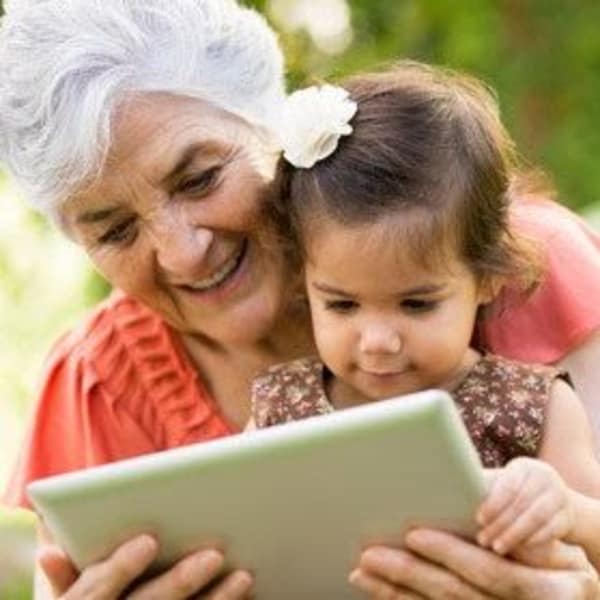 Woman reading to a child at The Phoenix at Estero in Estero, Florida