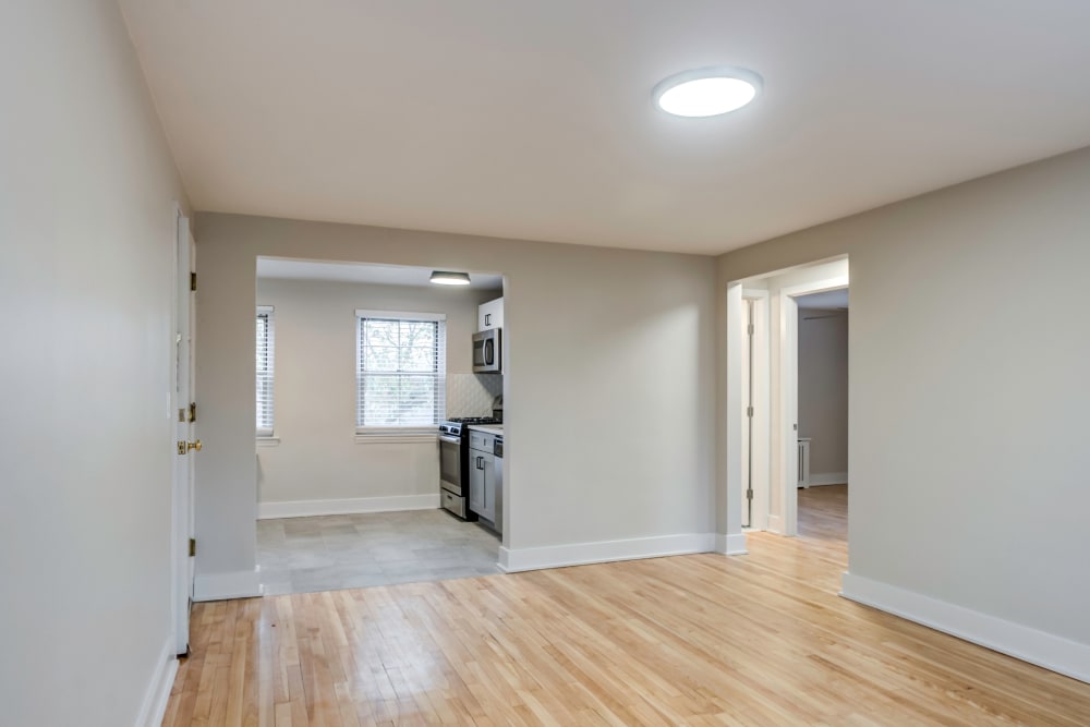 Spacious living room with wood-style flooring at Haven New Providence in New Providence, New Jersey
