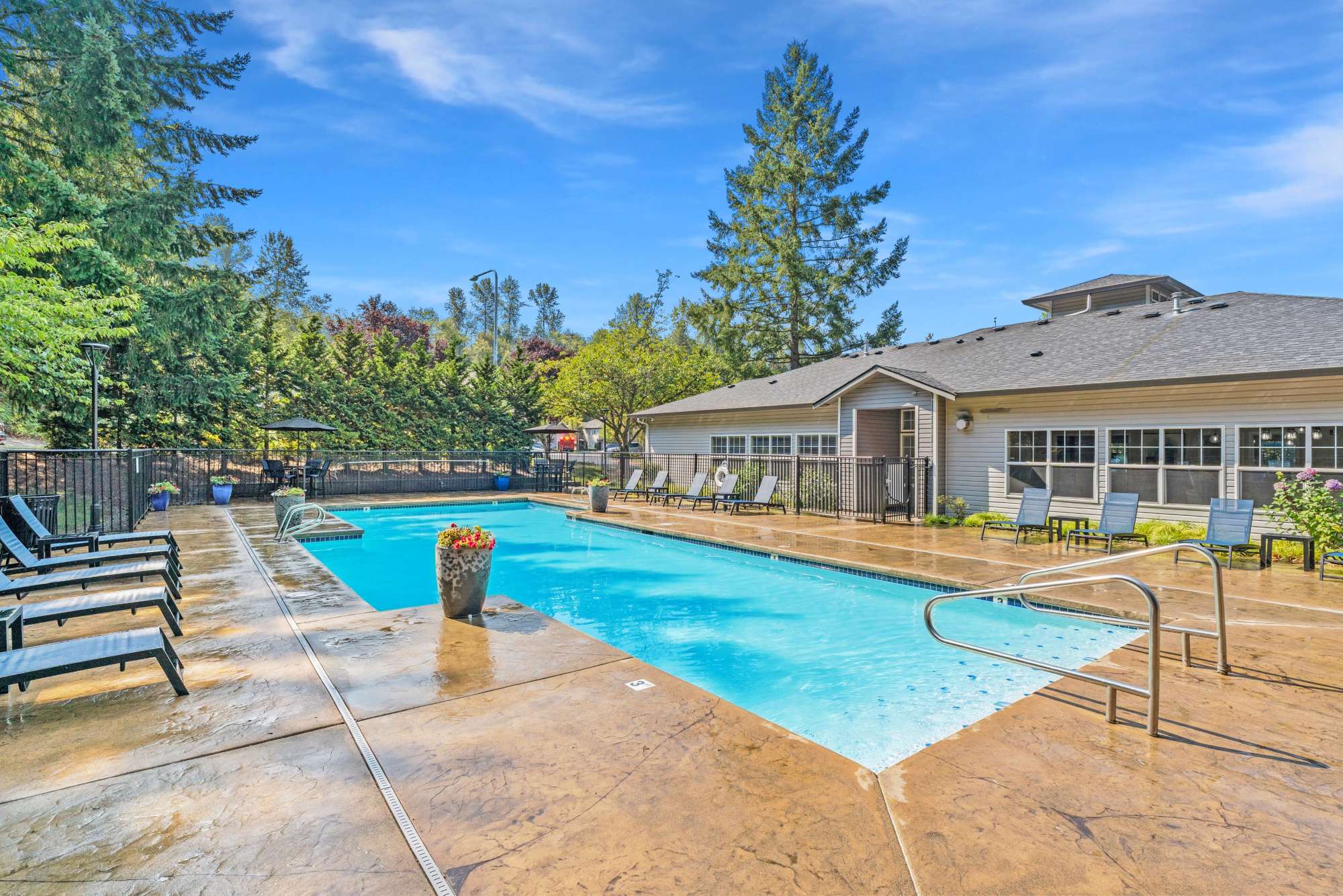 Large swimming pool at Pebble Cove Apartments in Renton, Washington