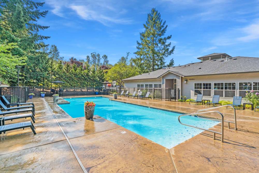 Large swimming pool at Pebble Cove Apartments in Renton, Washington