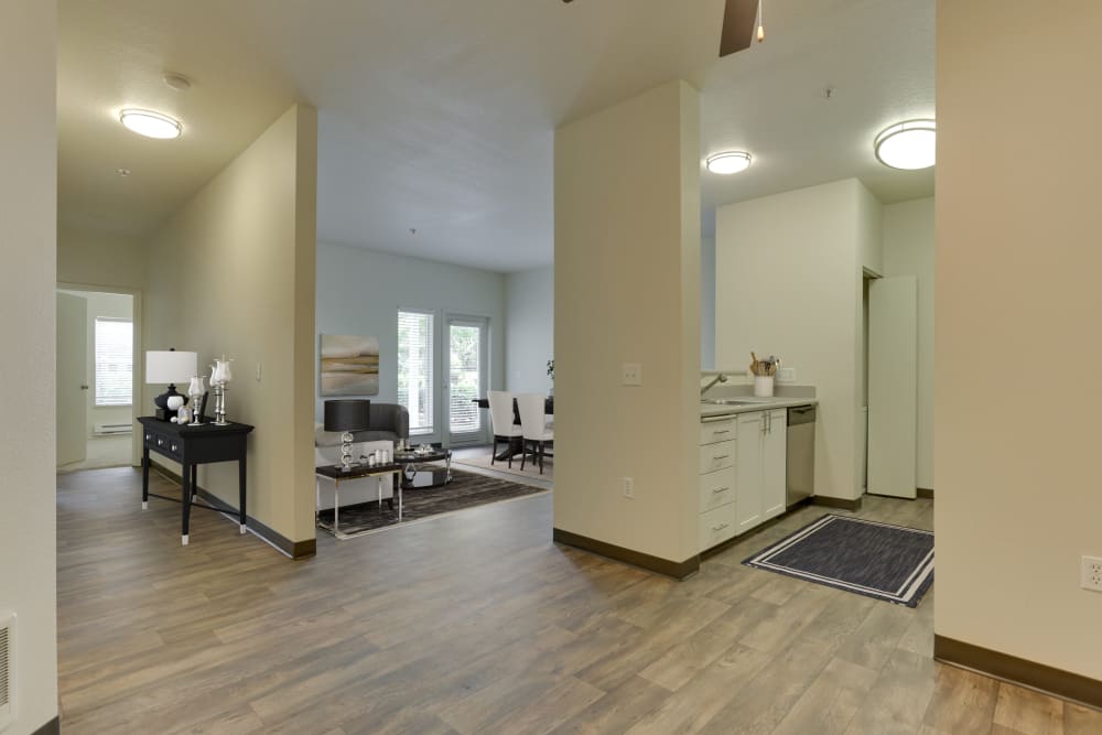 Entryway with wood-style flooring at The Landings at Morrison Apartments in Gresham, Oregon