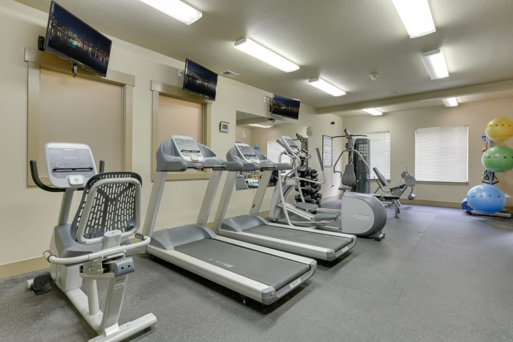 Fitness center with plenty of individual workout stations at The Landings at Morrison Apartments in Gresham, Oregon