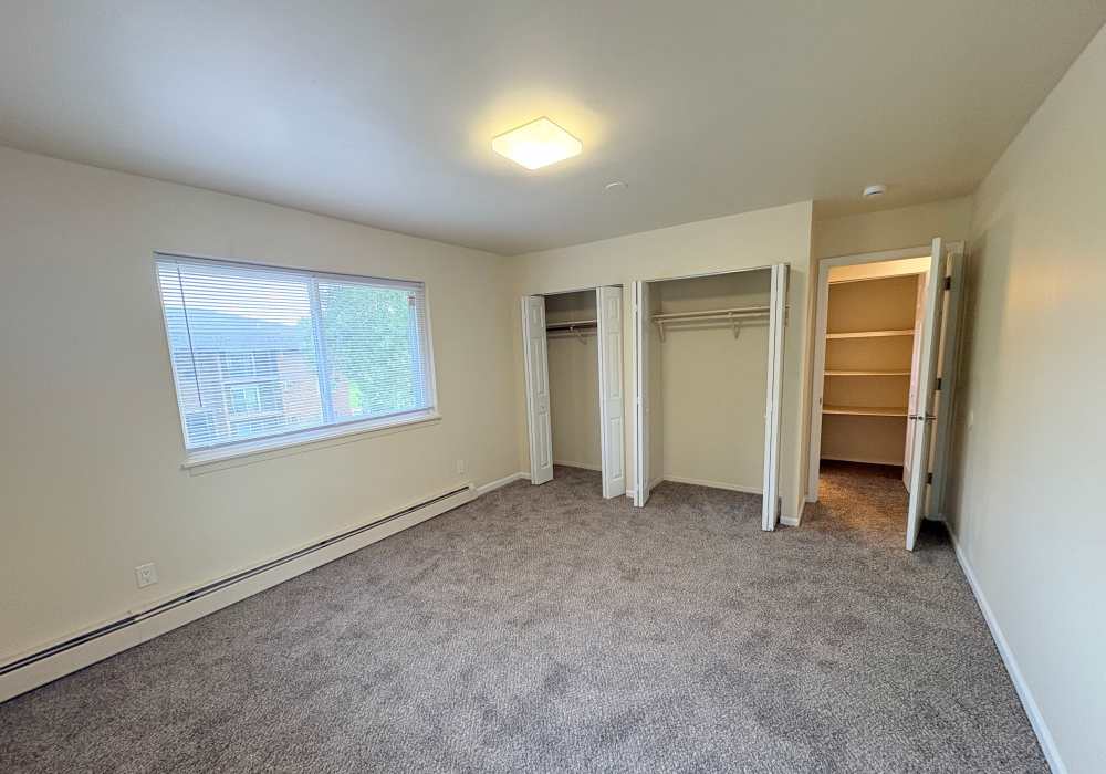 Bedroom with walk-in closet at Edgewood Group Apartments in Merrillville, Indiana