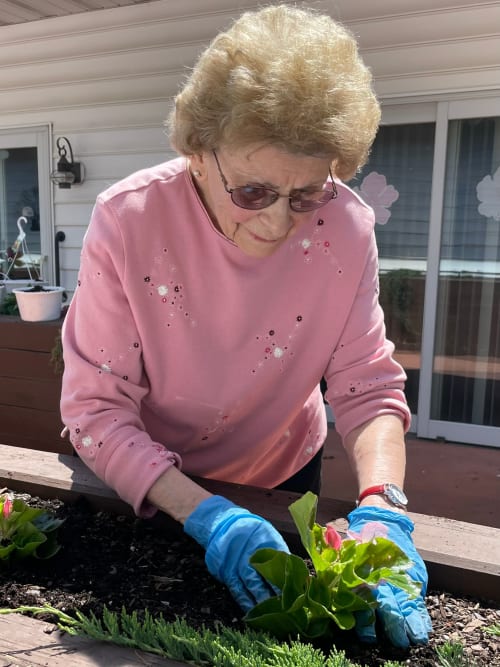 Resident enjoying the garden at Heritage Hill Senior Community in Weatherly, Pennsylvania