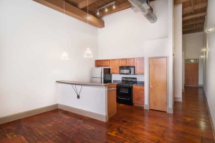 Spacious living room and kitchen at Porterdale Mill Lofts in Porterdale, Georgia