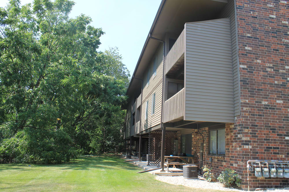 Apartments with beautiful landscaping at American Colony Apartments, in Greenfield , WI