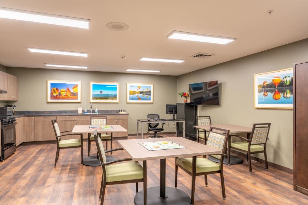 Kitchen area with 3 tables at Heron Pointe Senior Living in Monmouth, Oregon