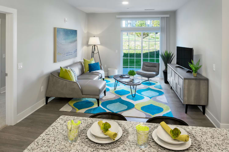 Spacious, well-lit living room at Cove at Gateway Commons in East Lyme, Connecticut