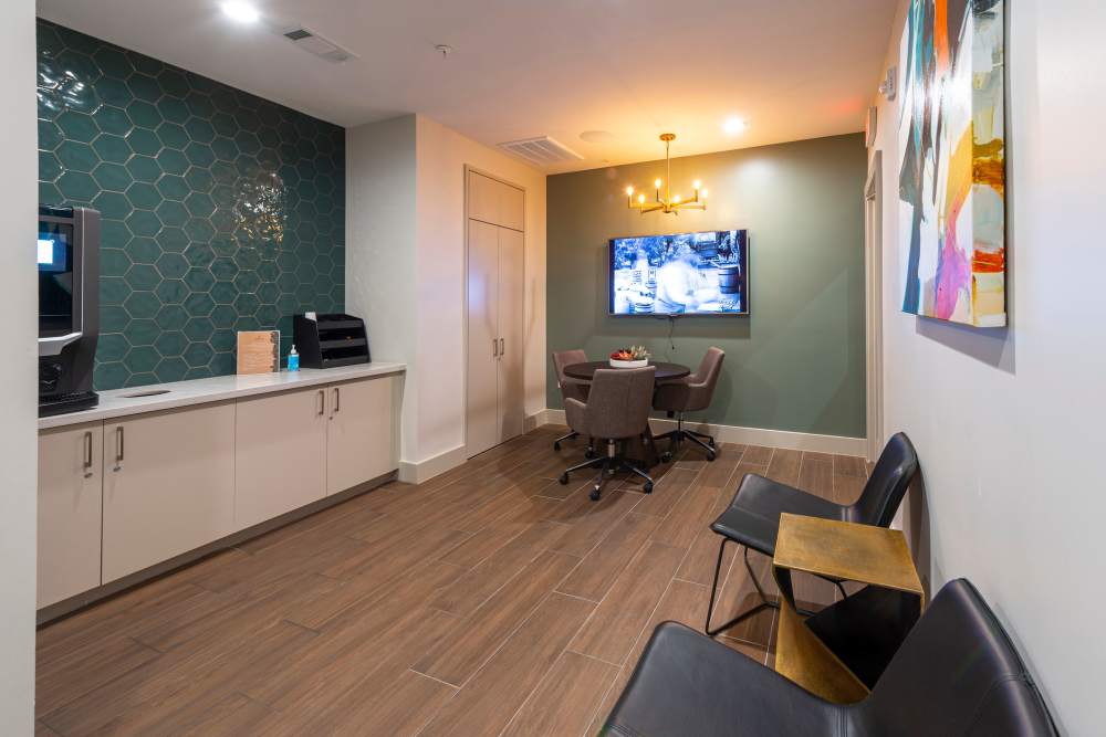 Coffee space of a clubhouse with connecting TV at Whitmore in Houston, Texas