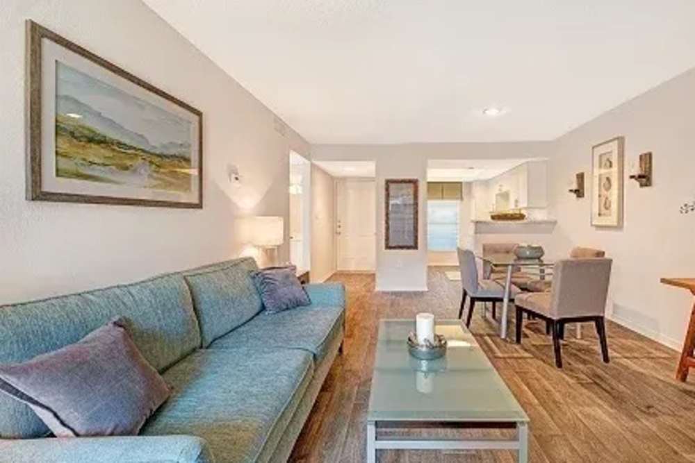 Living room with wood flooring at Andover at Crabtree in Raleigh. NC