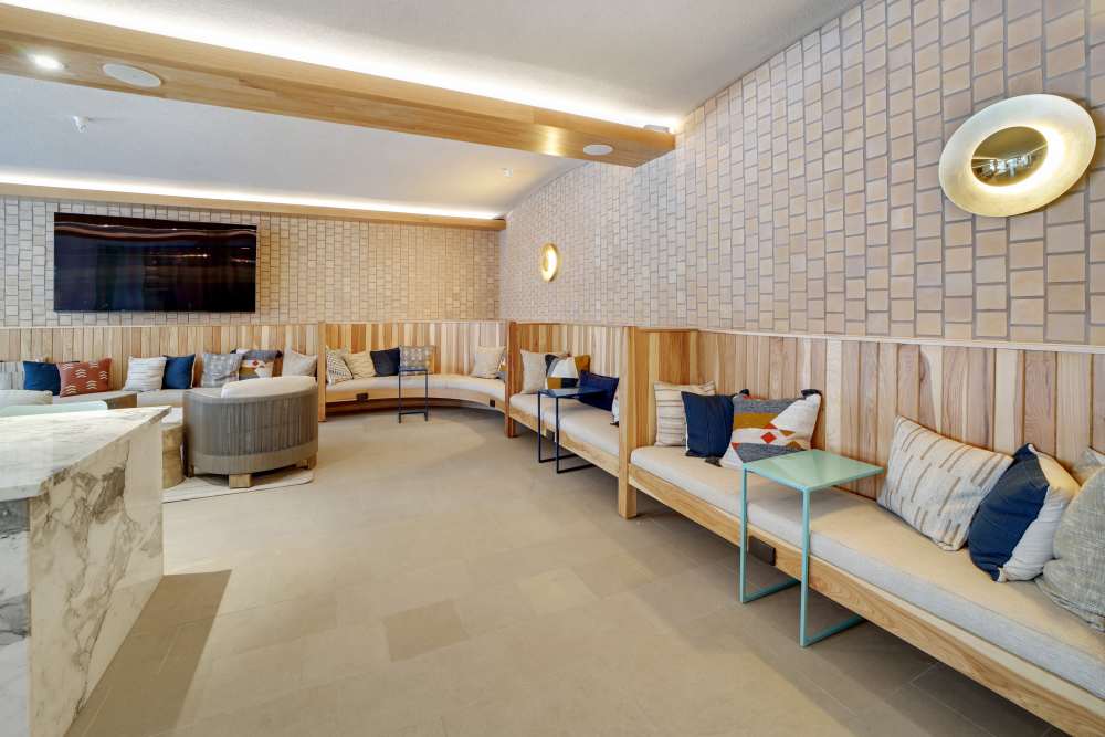 Clubhouse with a comfortable couch at Lydian in Phoenix, Arizona