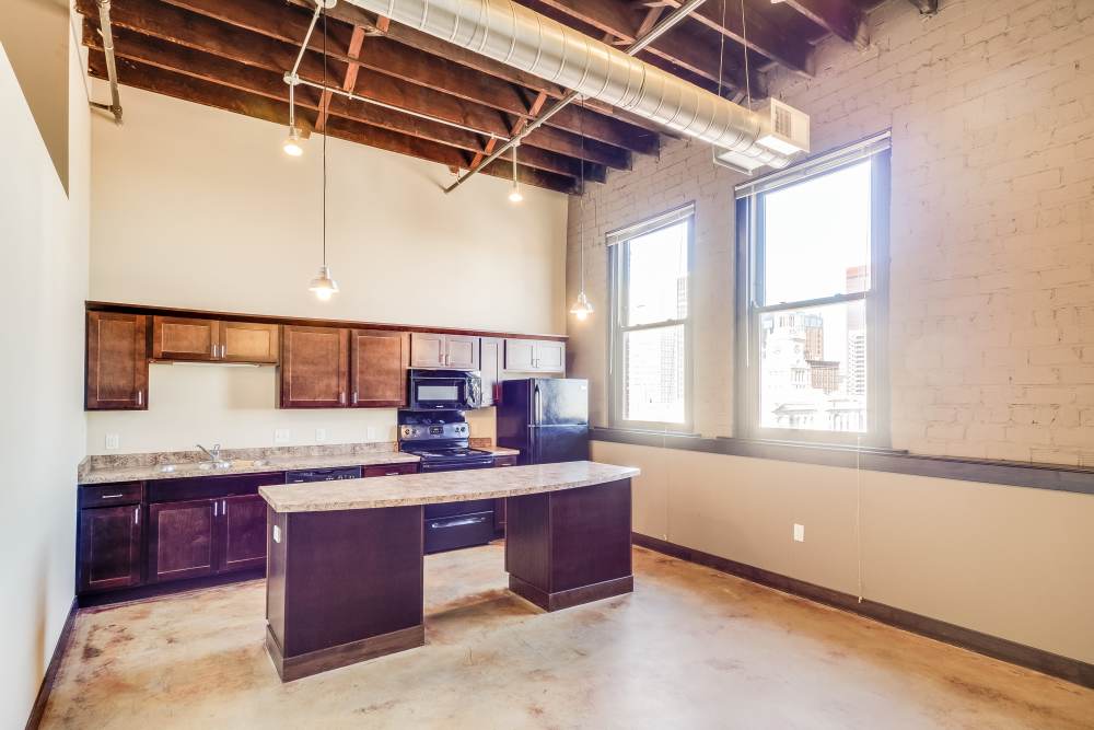 Large windows with city view at Rumely Lofts in Des Moines, Iowa