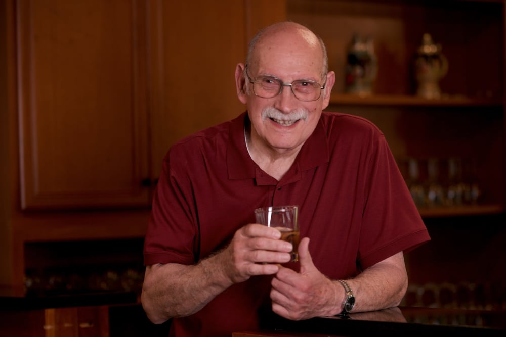 Smiling resident in his apartment at Traditions of Hanover in Bethlehem, Pennsylvania