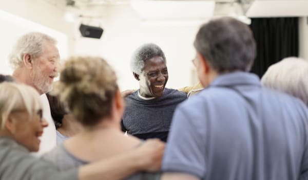 Residents gathered around socializing at Anthology of Plano in Plano, Texas