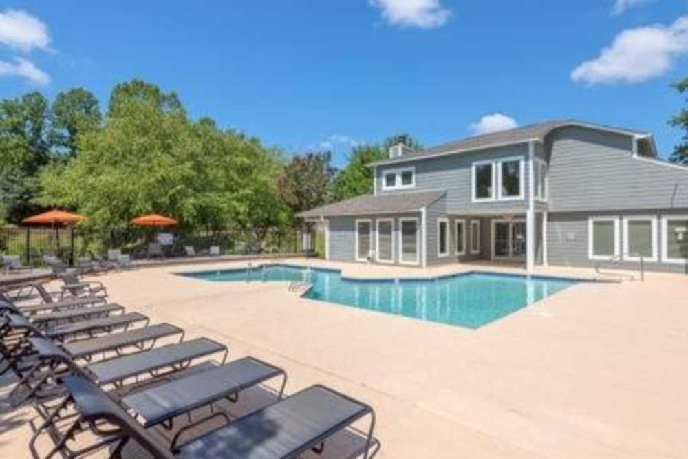 Lounge chairs by the pool at The Willow in Greensboro, North Carolina